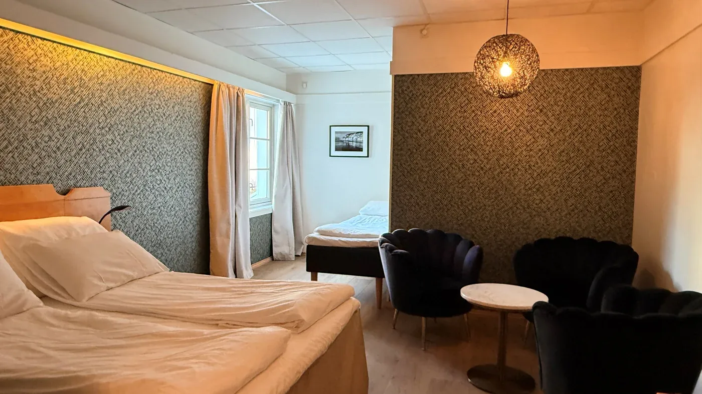 Trippelrom med sittegruppe